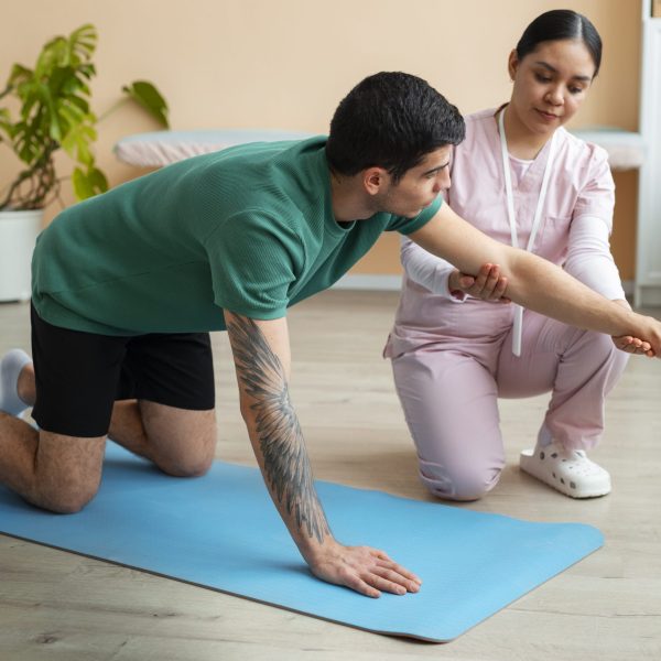 doctor-helping-patient-rehabilitation (1) doctor-helping-patient-rehabilitation (1)